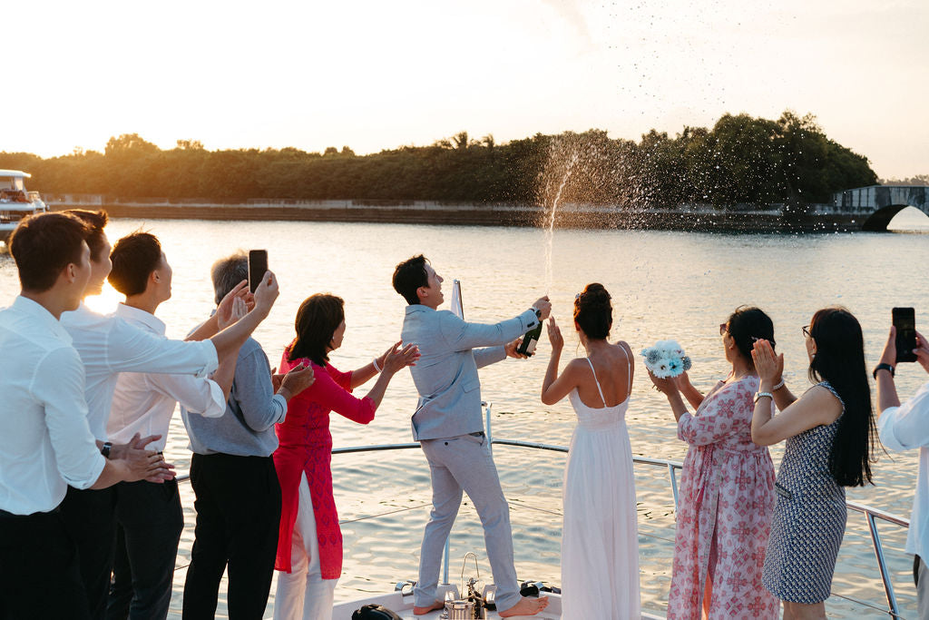 Guests celebrating a special occasion on a Yacht Maison charter in Singapore