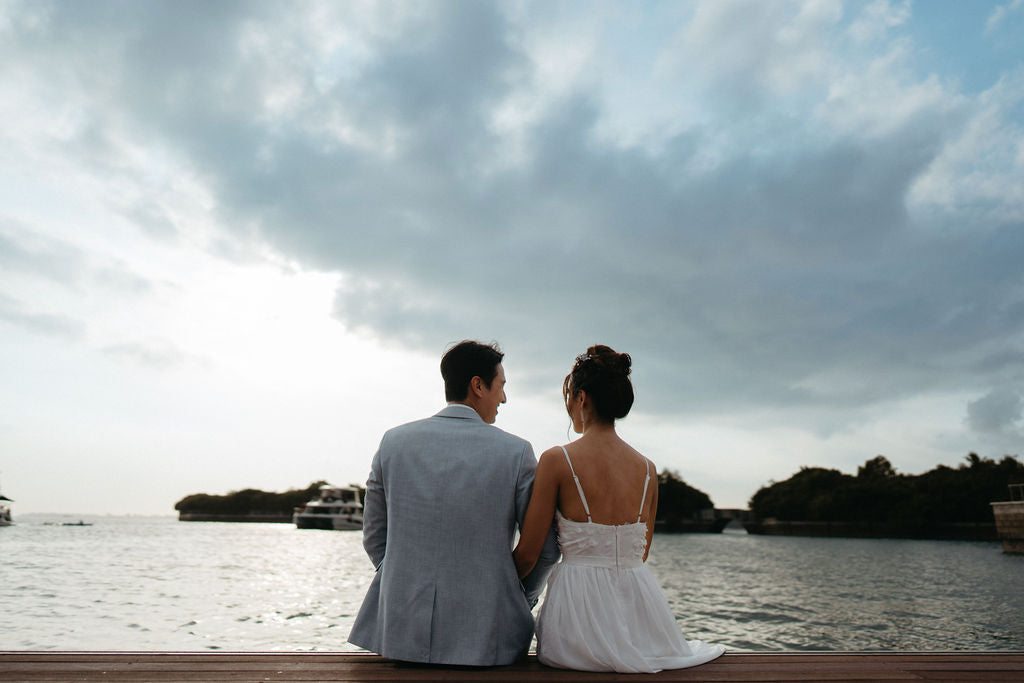 Bride and groom by the marina before their Yacht Maison wedding charter in Singapore