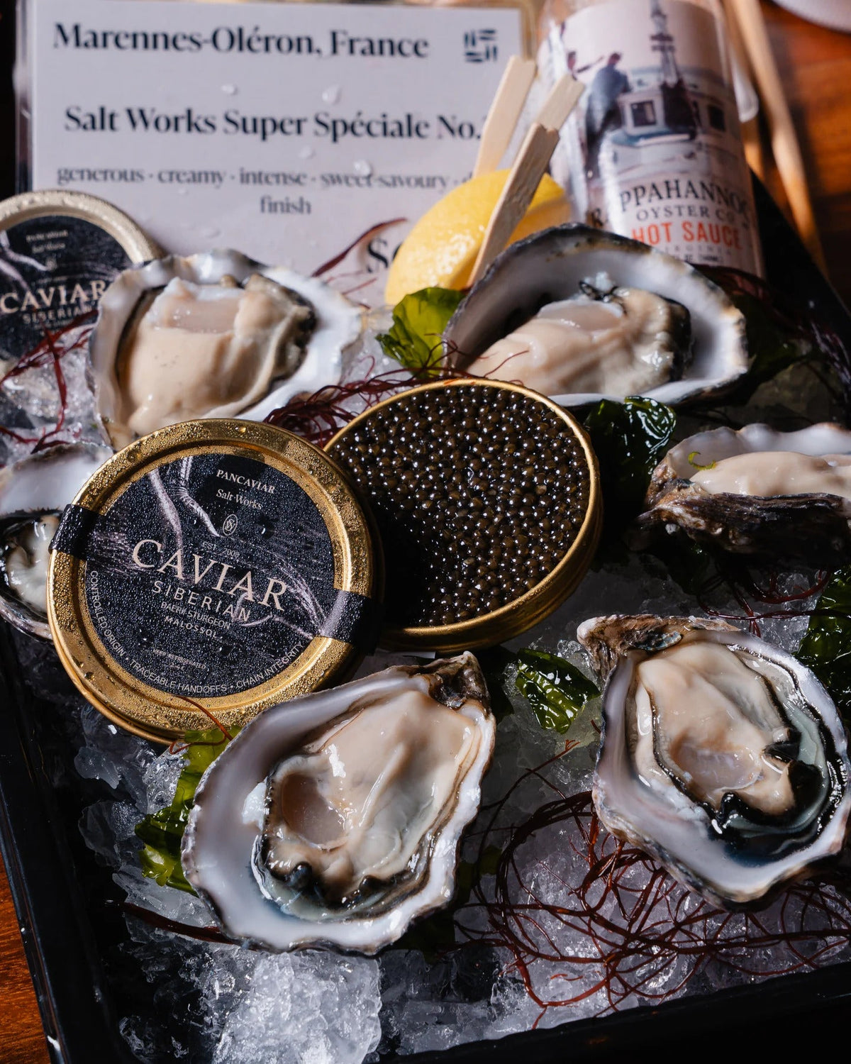 Claire oysters served with a tin of Salt Works caviar