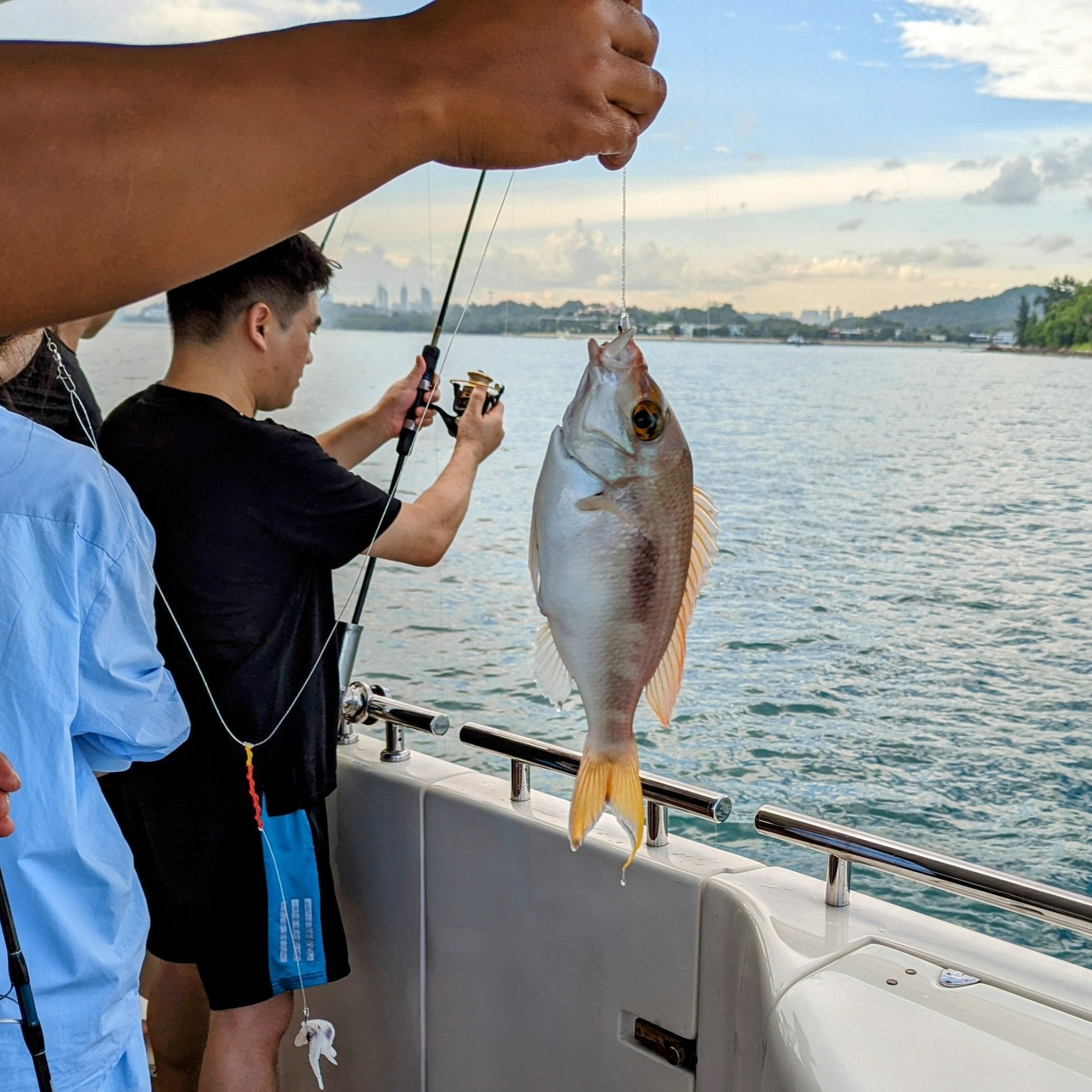 Deep-sea fishing charter with expert crew and gear on a Yacht Maison yacht in Singapore