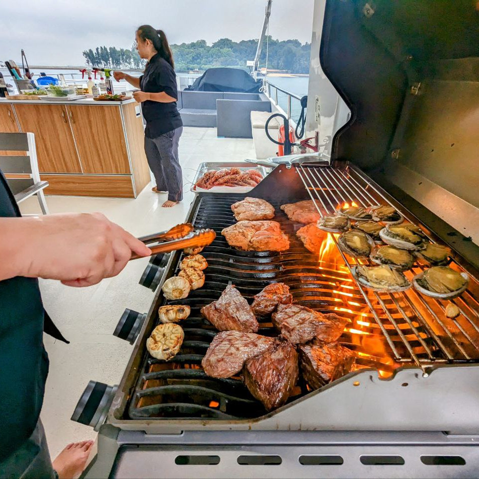Raw BBQ box self-grill setup on a Yacht Maison yacht in Singapore