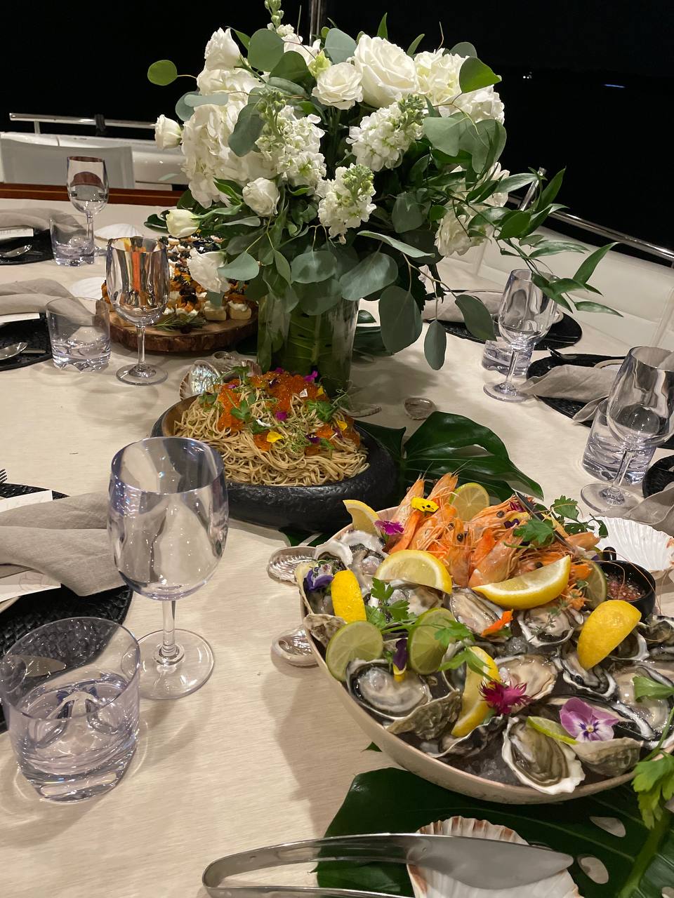 Intimate duo dining for two on a Yacht Maison yacht in Singapore